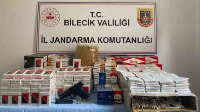 Jandarmanın baskın yaptığı evde kaçak tütün ve ruhsatsız silah ele geçirildi